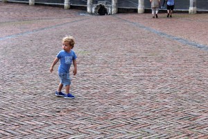 A boy runs through the Piazza del Campo in Siena, Italy on Wednesday June 8, 2016. The Piazza del Campo is famous for their “no rules horseracing” known as the Palio Horse Races. (Photograph by Kylie Warren)