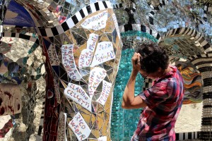 A woman looks at a piece of art in the Tarot Gardens in Capalbio, Italy on Wednesday, June 15, 2016. The Tarot Gardens is an art exhibit created by Niki De Saint Phalle. (Photograph by Kylie Warren)